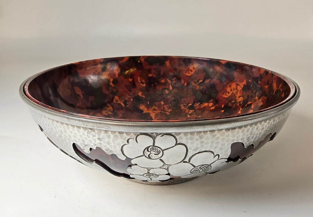A pierced pewter bowl with a  marbled Bakelite liner from the Art Deco period 
