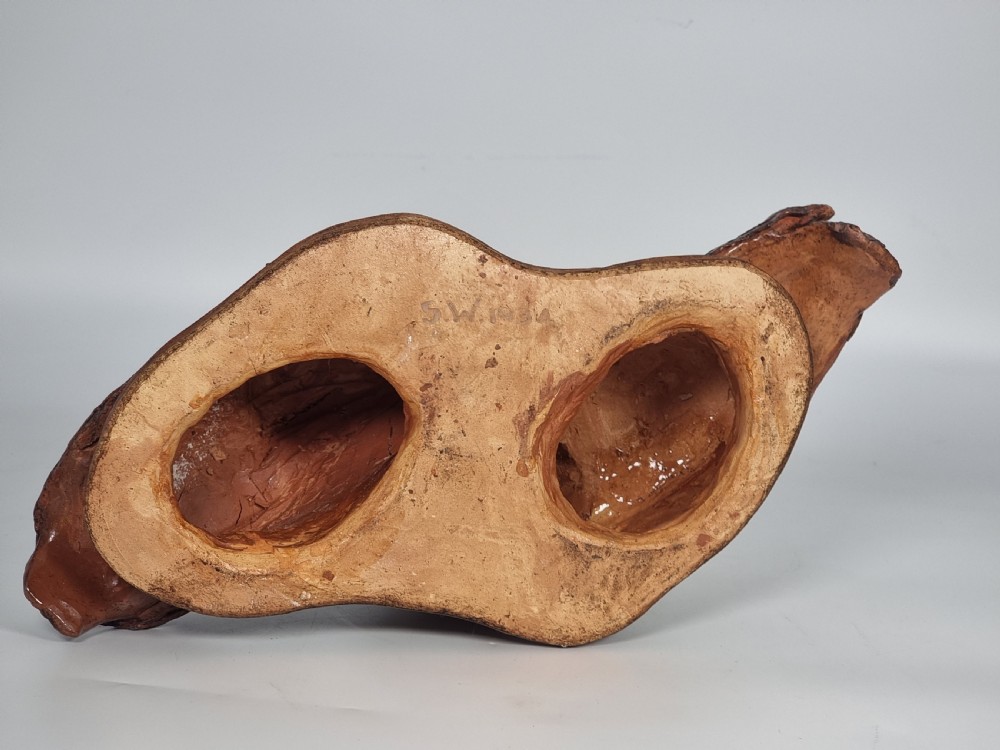 A hand-sculpted brown glazed pottery figurine of two owls perched together on a black ebonised wooden base. View XIV