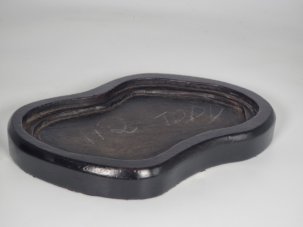 A hand-sculpted brown glazed pottery figurine of two owls perched together on a black ebonised wooden base. View XV