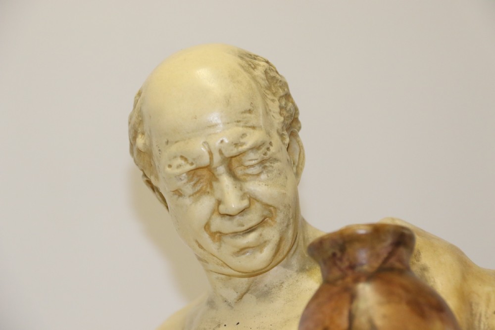 A 19th-century Goldscheider terracotta sculpture depicting a classical Roman male figure draped in robes, holding a vessel in one hand and a harvested bird in the other. View II