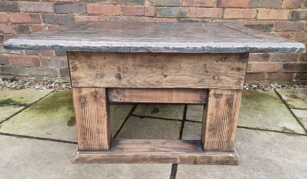 A low square rustic oak coffee table featuring a dark hand-painted geometric top and heavy timber legs. View III