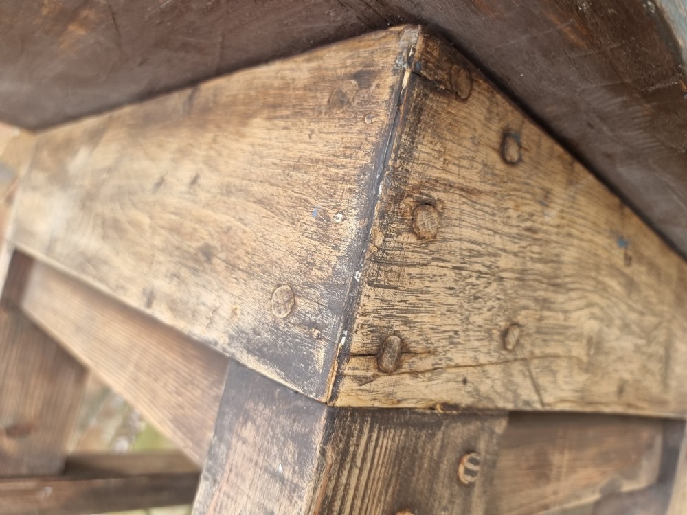 A low square rustic oak coffee table featuring a dark hand-painted geometric top and heavy timber legs. View XX