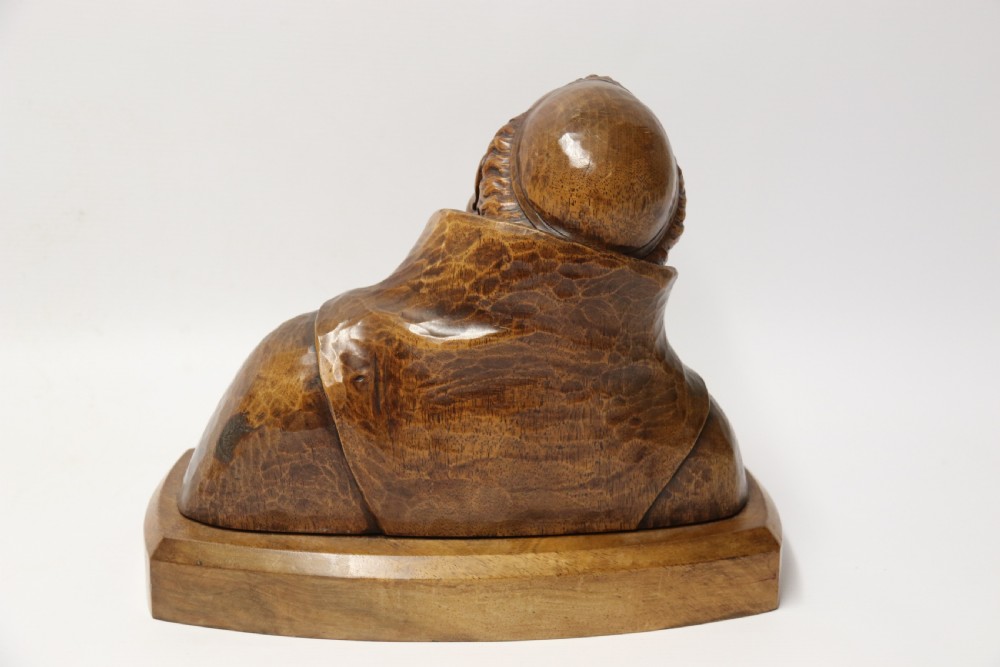 A late 19th-century hand-carved walnut study bust depicting a hooded monk on a moulded wooden base. View IV
