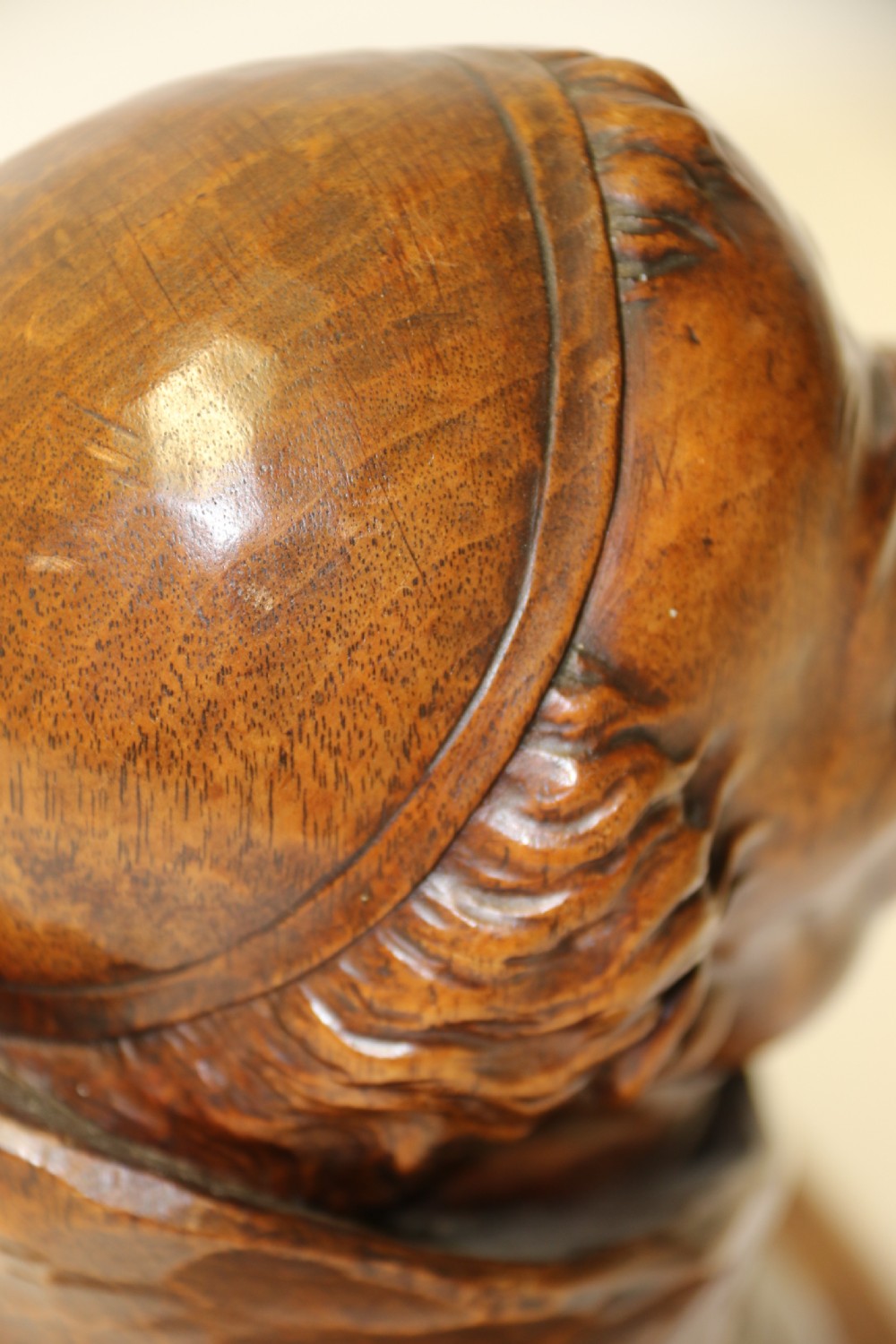 A late 19th-century hand-carved walnut study bust depicting a hooded monk on a moulded wooden base. View X