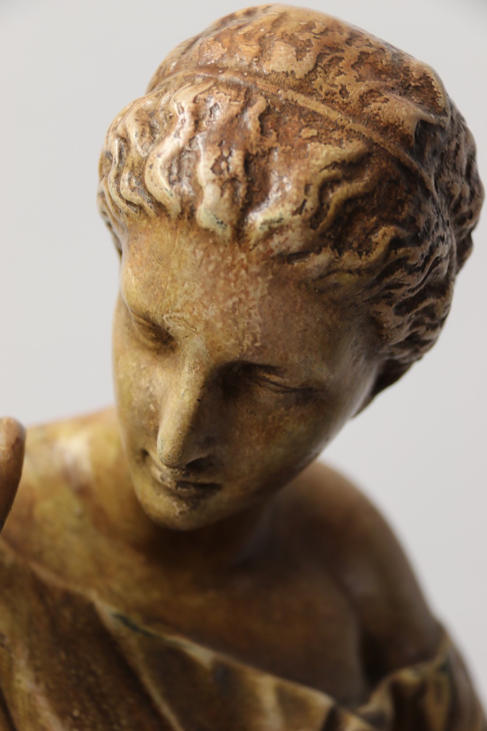 A nineteenth-century Neoclassical sculpture depicting Diana the Huntress draped in classical robes standing on a square base with a warm beige patinated finish. View XI