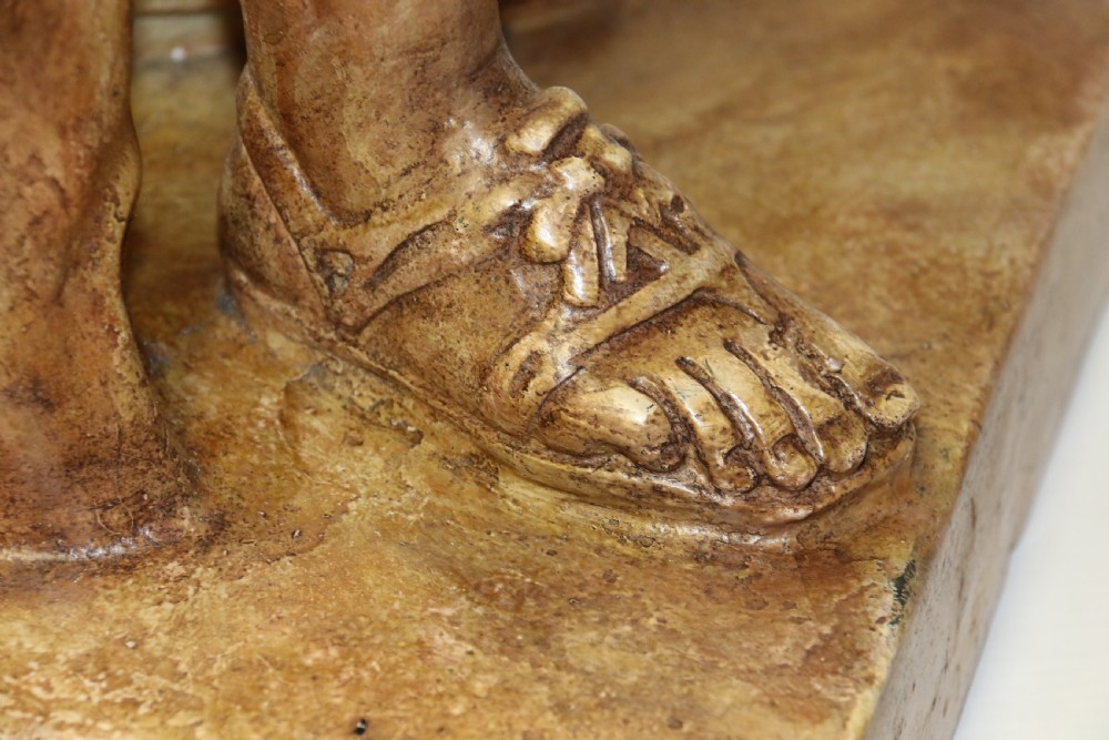A nineteenth-century Neoclassical sculpture depicting Diana the Huntress draped in classical robes standing on a square base with a warm beige patinated finish. View XV