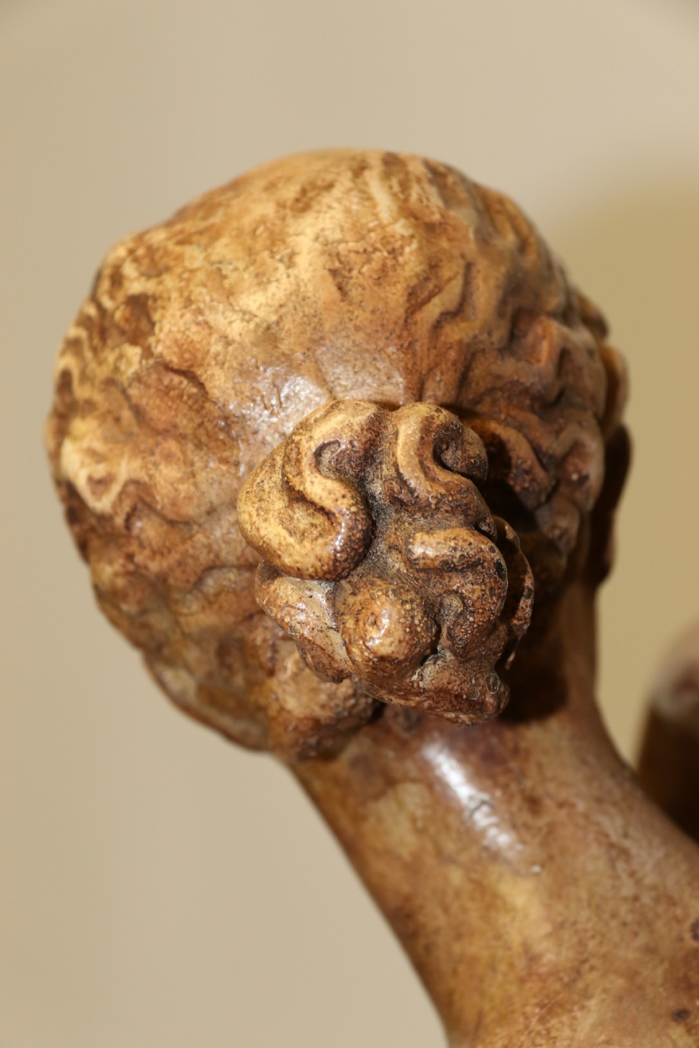 A nineteenth-century Neoclassical sculpture depicting Diana the Huntress draped in classical robes standing on a square base with a warm beige patinated finish. View XVII