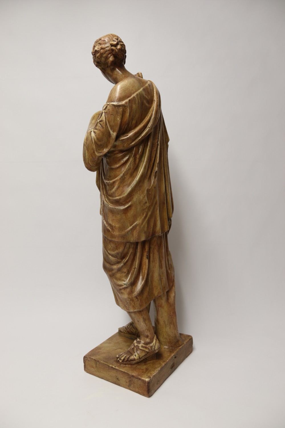 A nineteenth-century Neoclassical sculpture depicting Diana the Huntress draped in classical robes standing on a square base with a warm beige patinated finish. View XXII