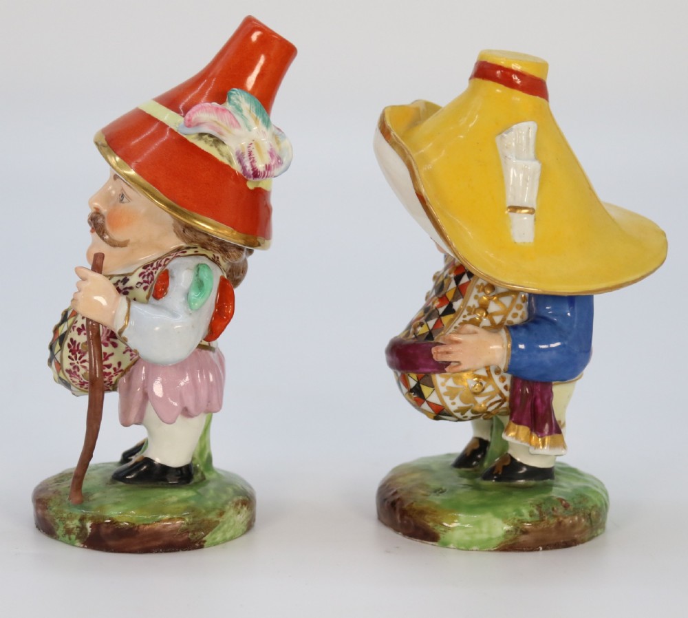 A pair of 19th-century hand-painted Samson porcelain Mansion House dwarf figurines featuring oversized hats and patterned waistcoats. View III