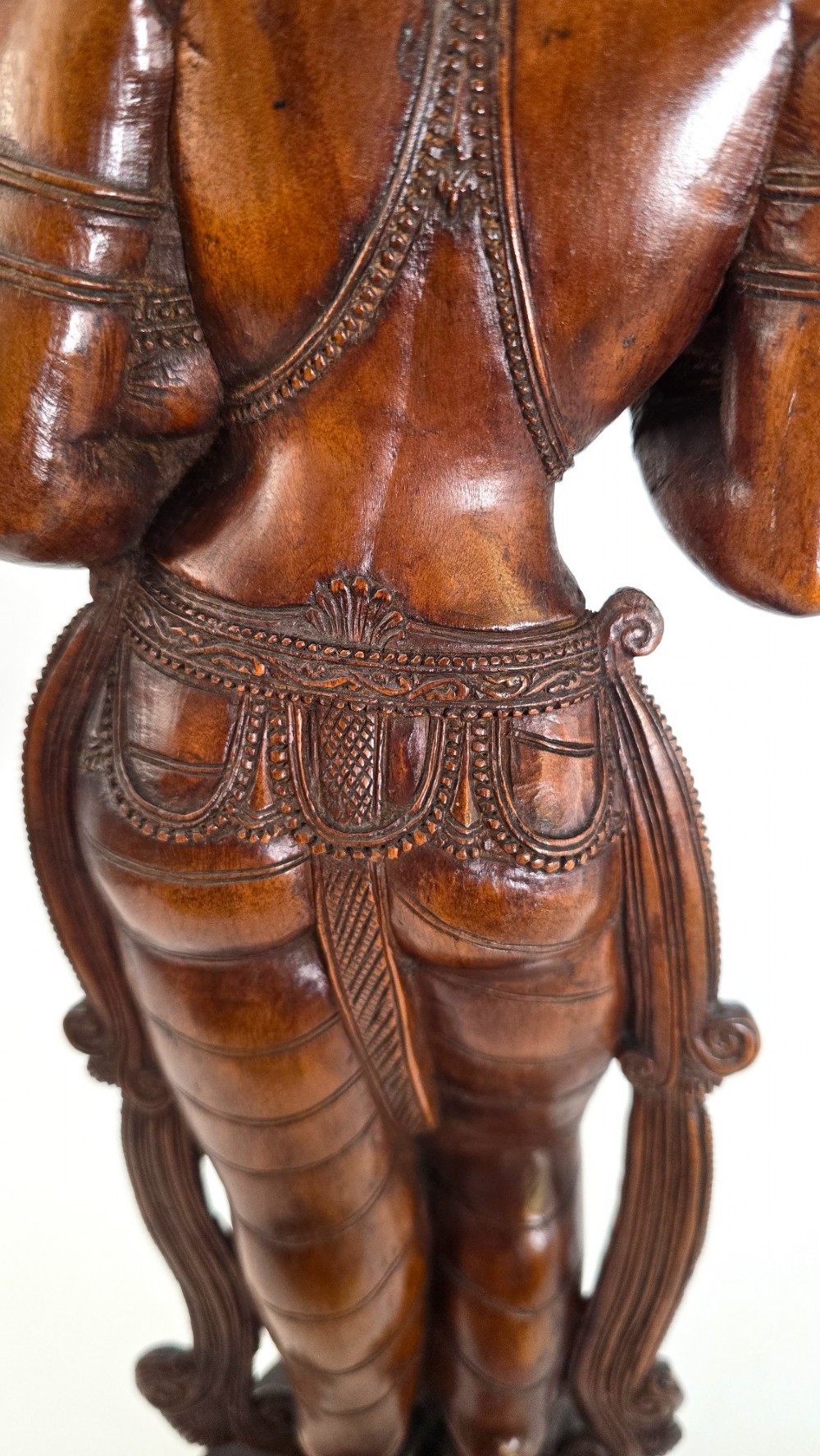 A hand-carved dark wood statue depicting the Goddess Parvati holding infant Ganesha, mounted on an octagonal wooden base. View X