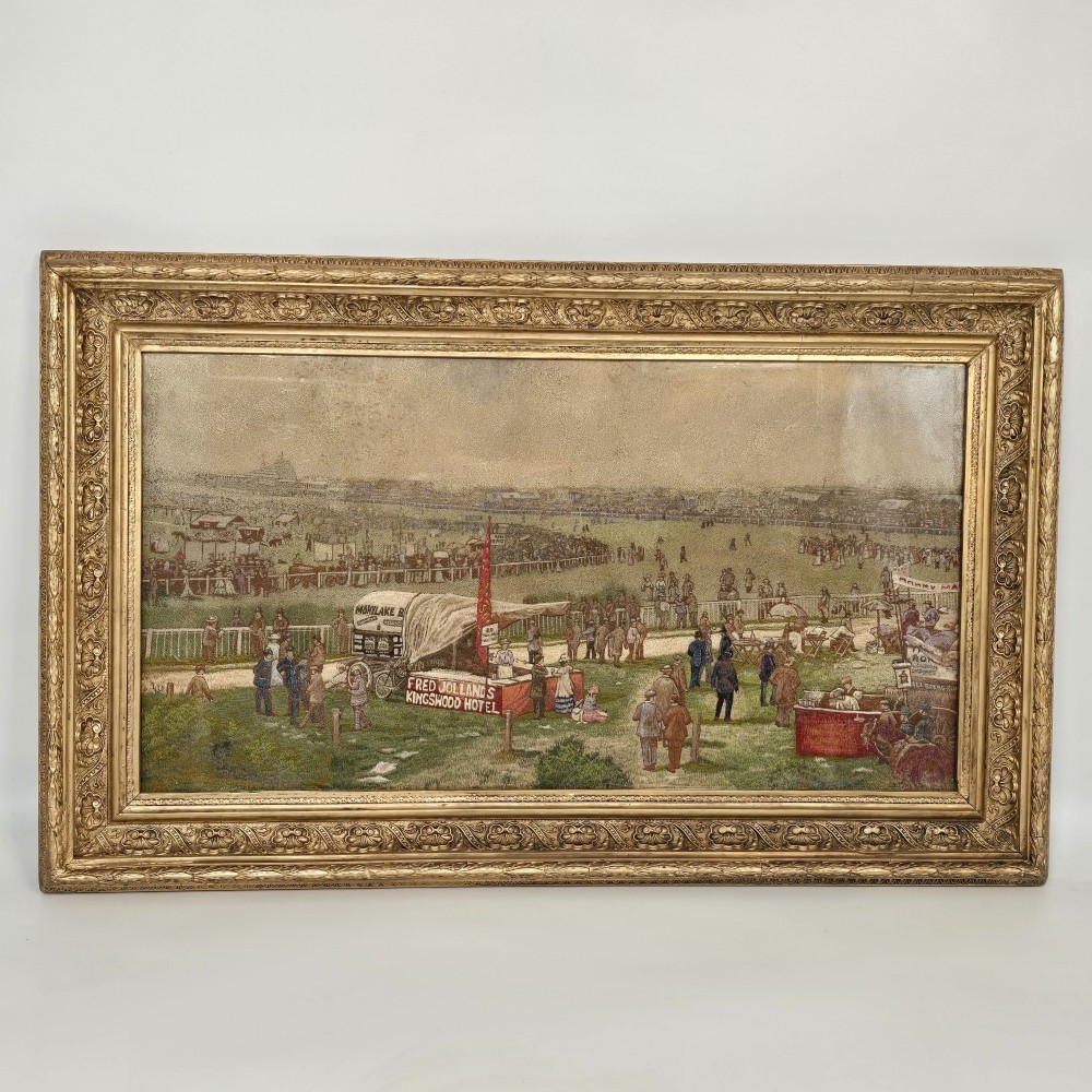 A framed rectangular silk needlework picture depicting figures gathered at the Epsom racecourse within an ornate gilded frame. View XII