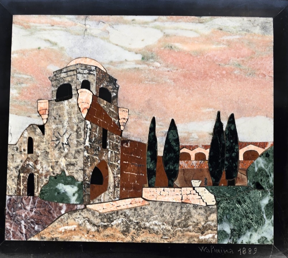 A framed Italian pietra dura panel depicting a stone building and cypress trees rendered in inlaid coloured marble. View II
