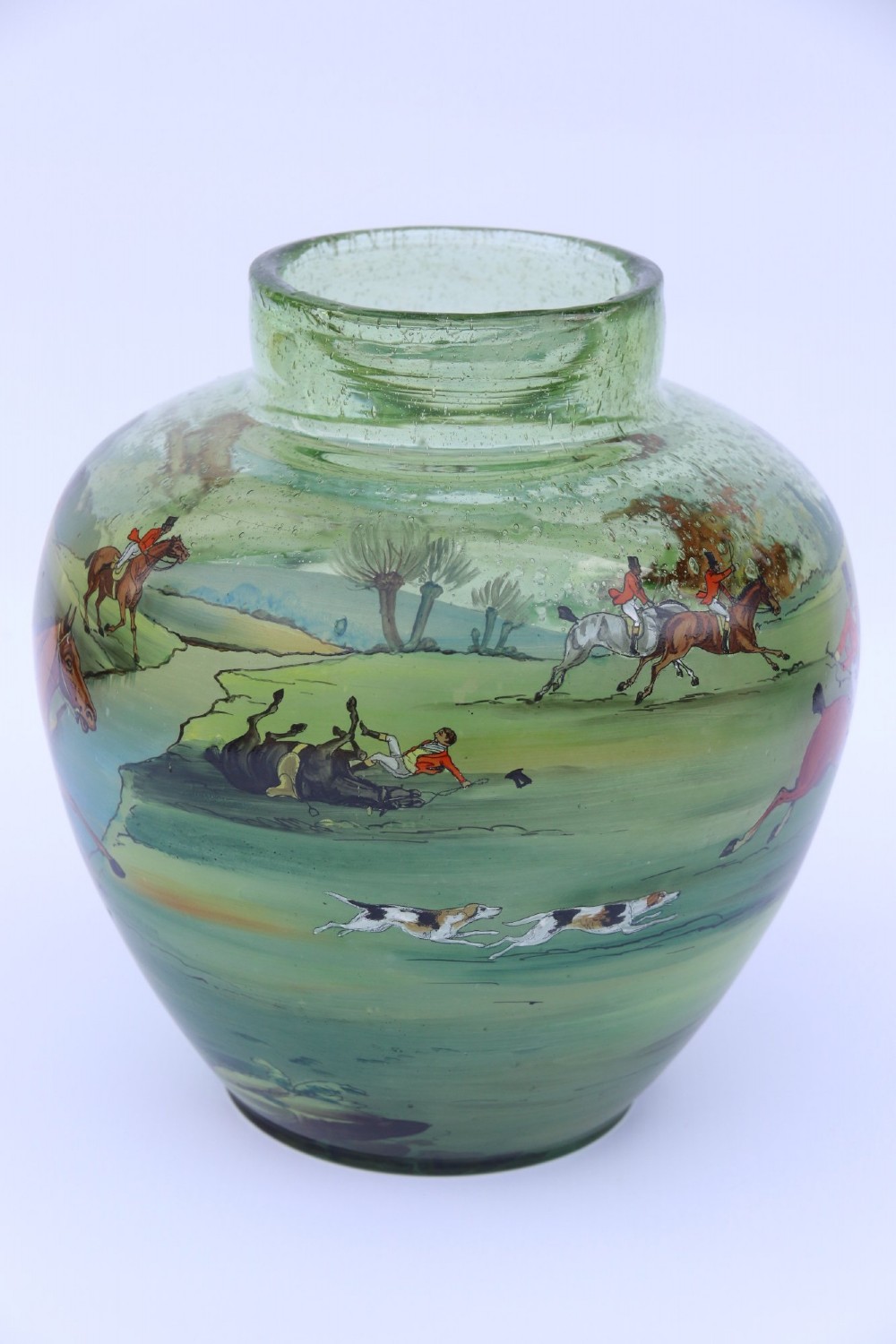 A bulbous green hand-blown glass vase featuring a hand-painted enamel scene of fox hunters riding horses across a landscape. View IV