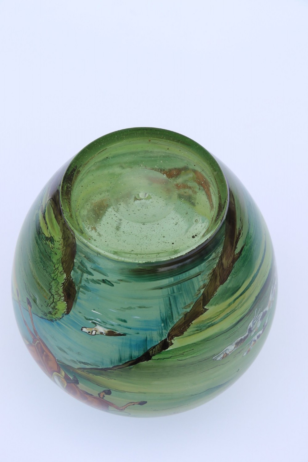 A bulbous green hand-blown glass vase featuring a hand-painted enamel scene of fox hunters riding horses across a landscape. View XIV