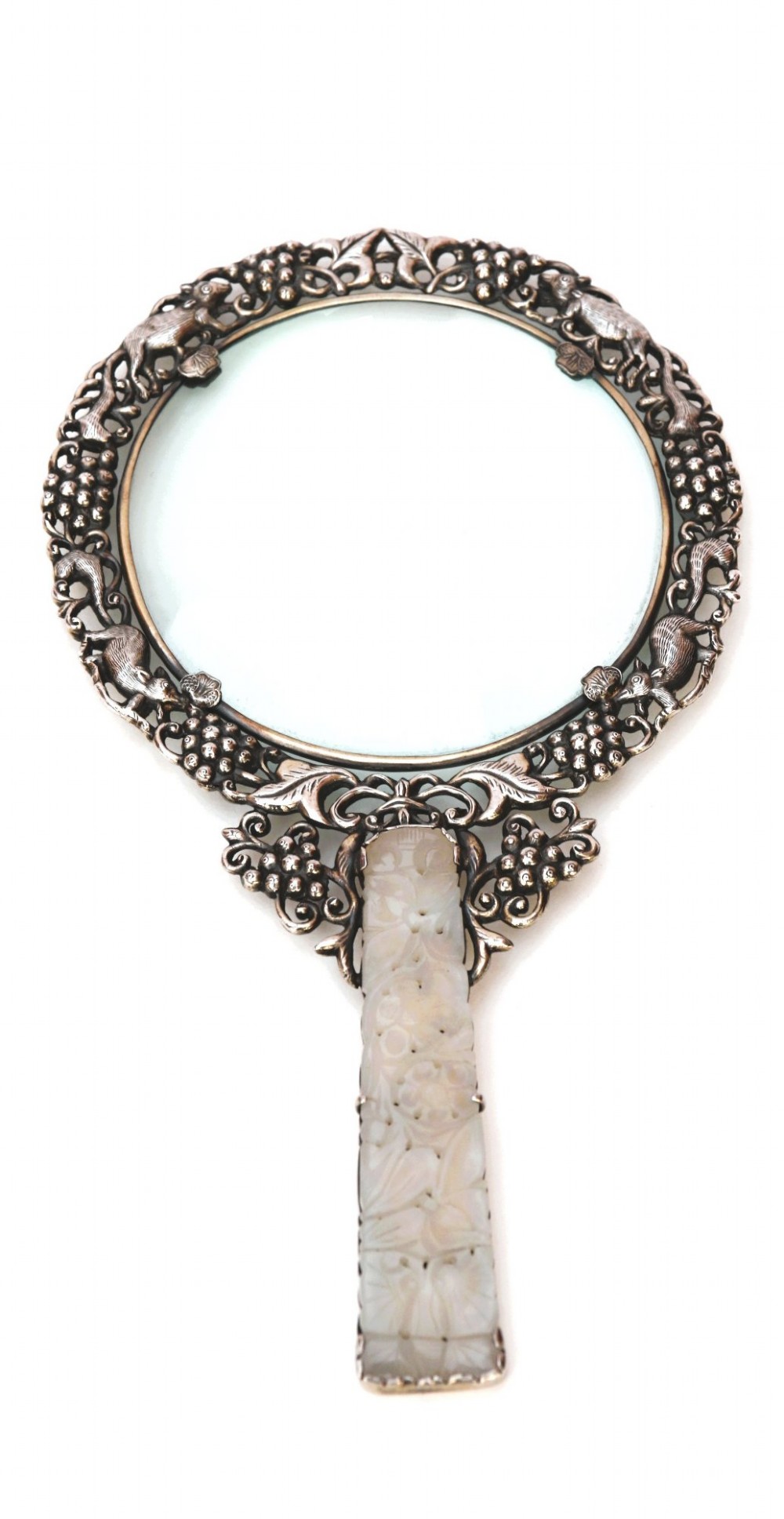 A late 19th-century Chinese silver magnifying glass featuring a carved white jade handle and an openwork grapevine frame with animal details. View XV