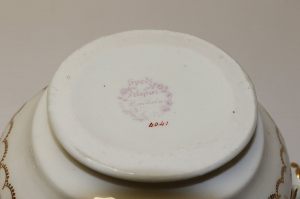 A white Regency Spode felspar porcelain covered sucrier featuring hand-painted green leaves, blue cornflowers, twin scrolled handles, and gilded embellishments. View XIII