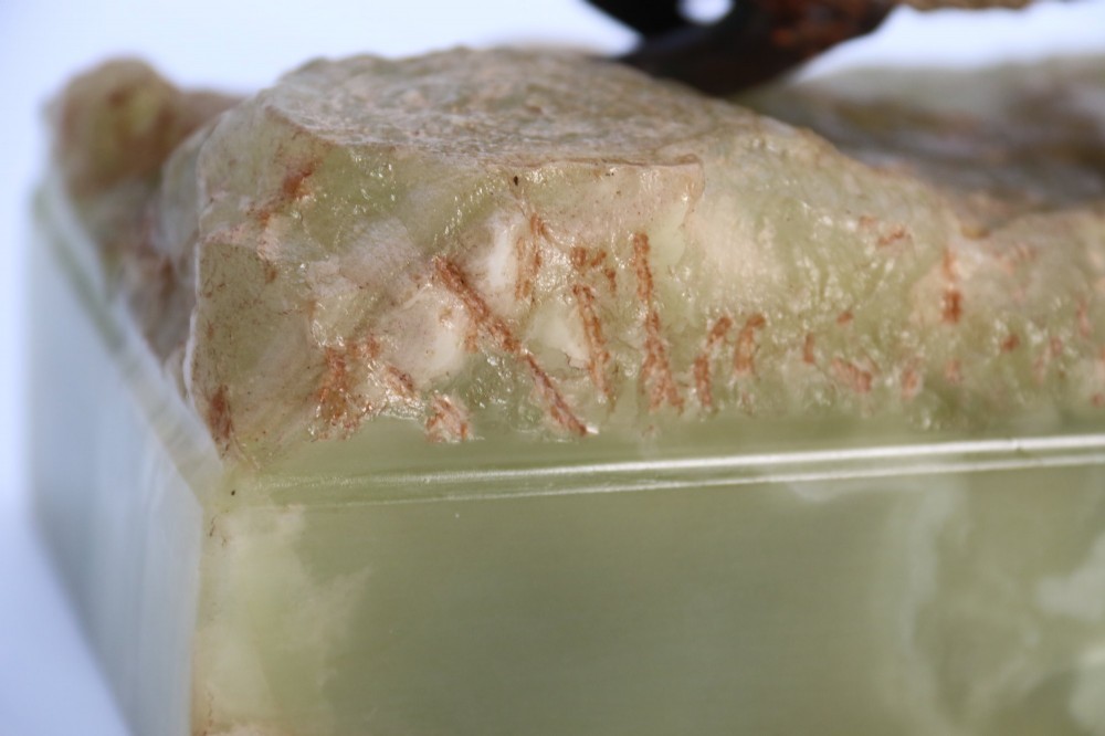 A cold-painted bronze sculpture of a fox in motion, mounted upon a rectangular carved green onyx base. View XV