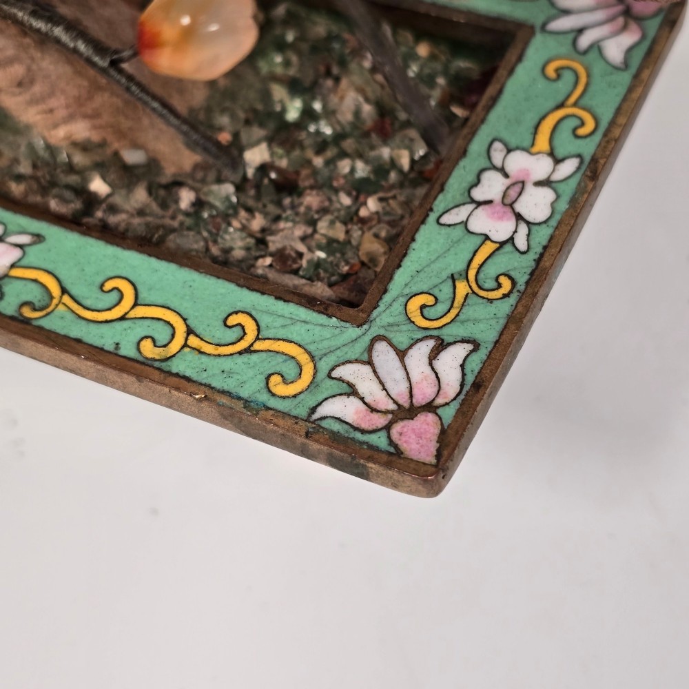 A Chinese decorative bonsai tree featuring carved amber-coloured hardstone plum blossoms on wired branches set inside a turquoise floral cloisonne planter. View V