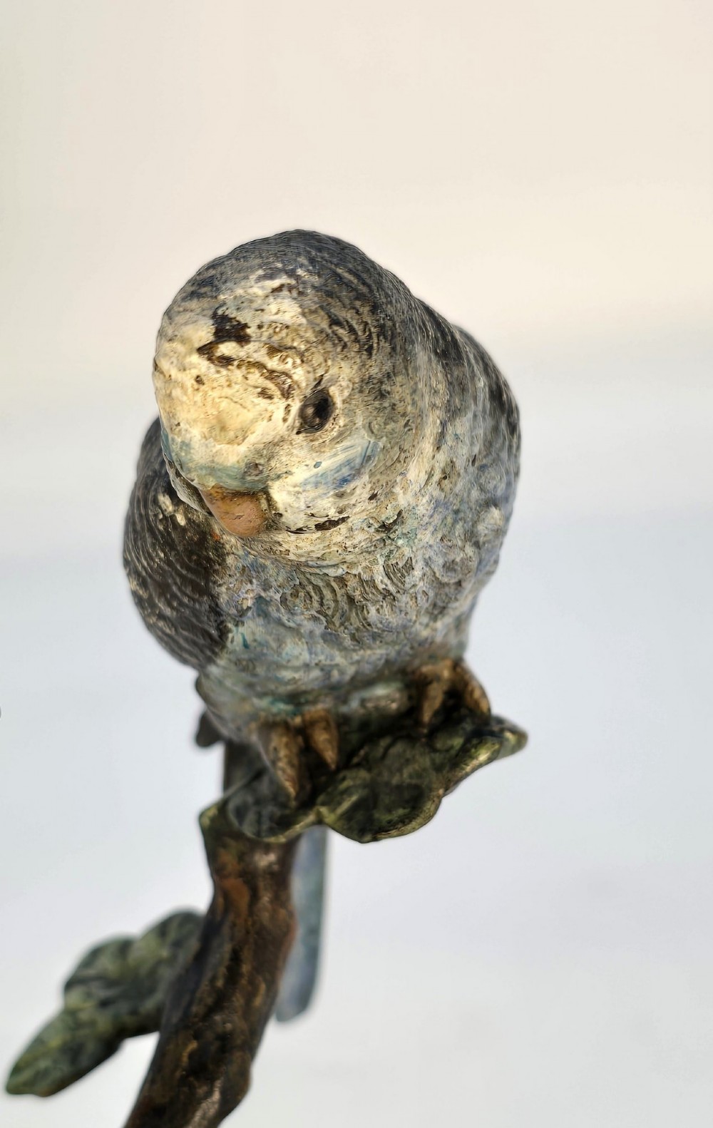 A cold-painted bronze sculpture featuring two budgerigars perched on a branch mounted upon a round green marble base. View XIV