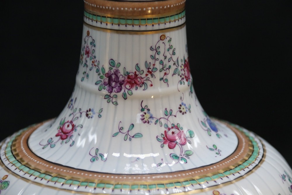 A bulbous hand-painted white porcelain vase with vertical fluting, decorated with floral sprigs and gold gilded borders. View VIII
