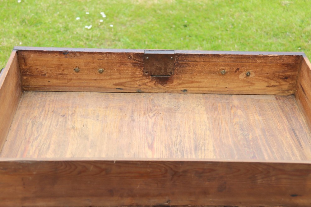 A George II burr elm lowboy featuring three drawers, brass drop handles, a scalloped apron, and cabriole legs terminating in pad feet. View X