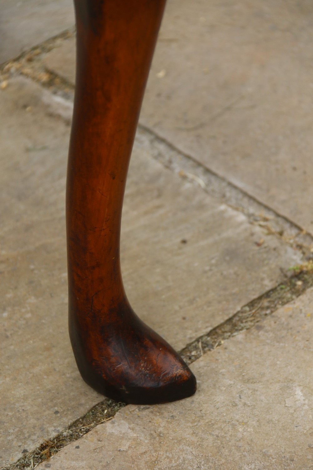 A George II burr elm lowboy featuring three drawers, brass drop handles, a scalloped apron, and cabriole legs terminating in pad feet. View XII
