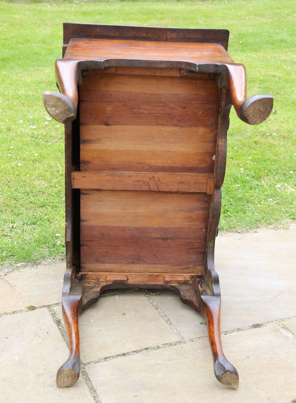 A George II burr elm lowboy featuring three drawers, brass drop handles, a scalloped apron, and cabriole legs terminating in pad feet. View XIV