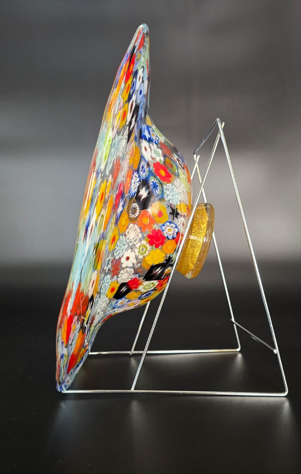 A circular Murano millefiori glass bowl featuring dense, colourful mosaic cane patterns arranged in starburst and floral formations. View II