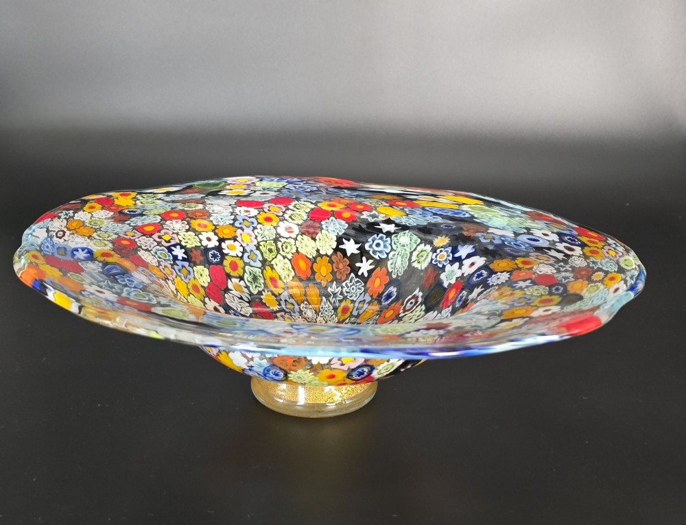 A circular Murano millefiori glass bowl featuring dense, colourful mosaic cane patterns arranged in starburst and floral formations. View XIV
