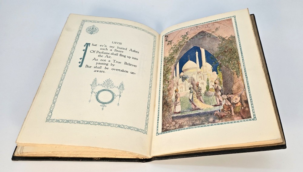 An Edwardian black leather bound edition of the Rubaiyat of Omar Khayyam featuring gilt and red embellished lettering with geometric corner tooling. View X