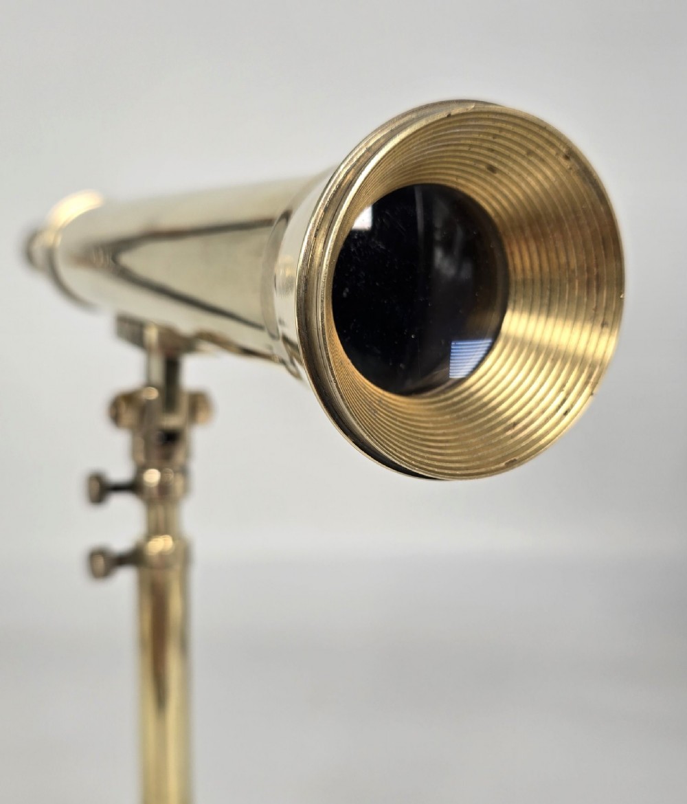 A Victorian brass table telescope mounted on a folding brass tripod stand. View II