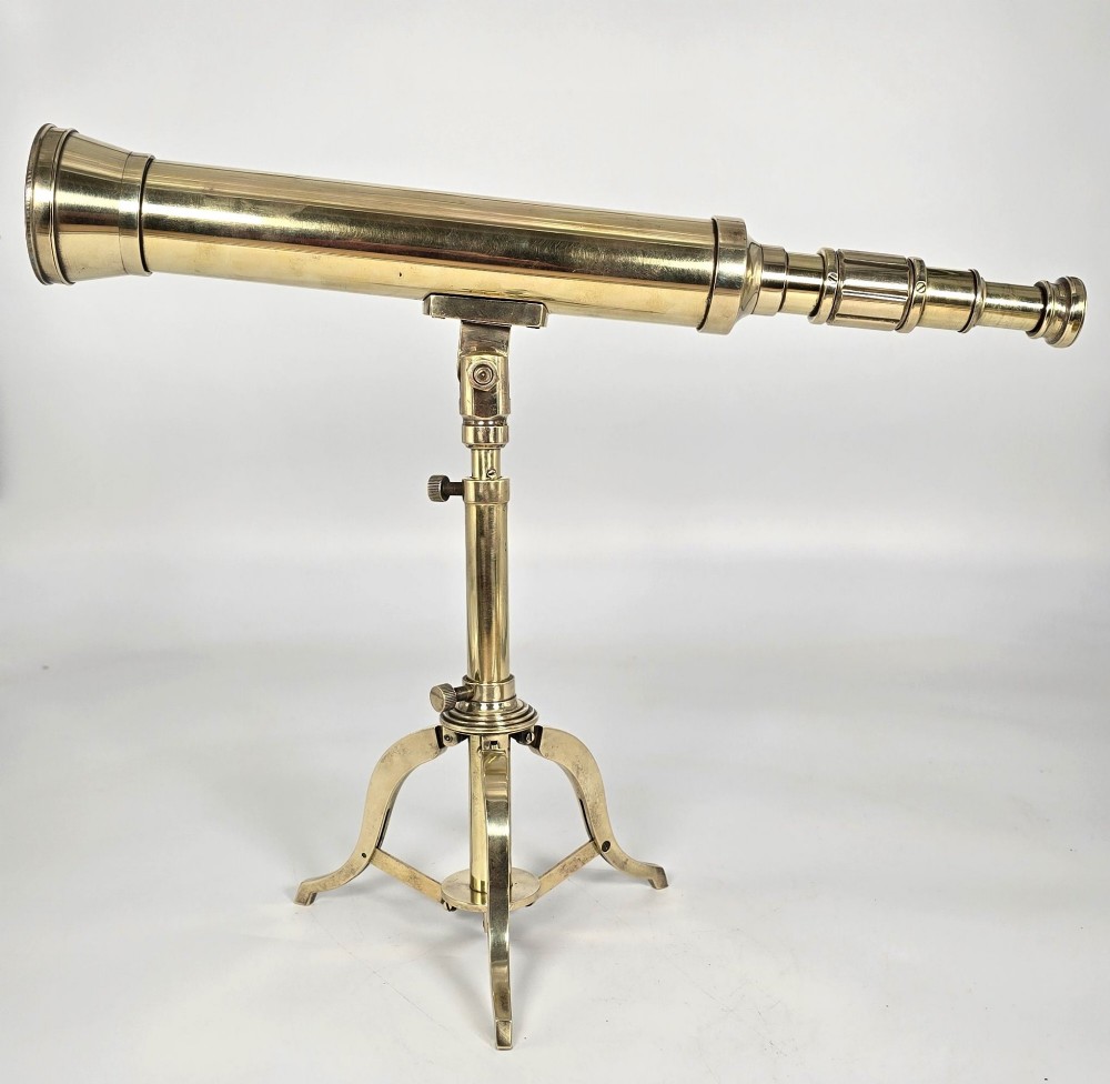 A Victorian brass table telescope mounted on a folding brass tripod stand. View IV