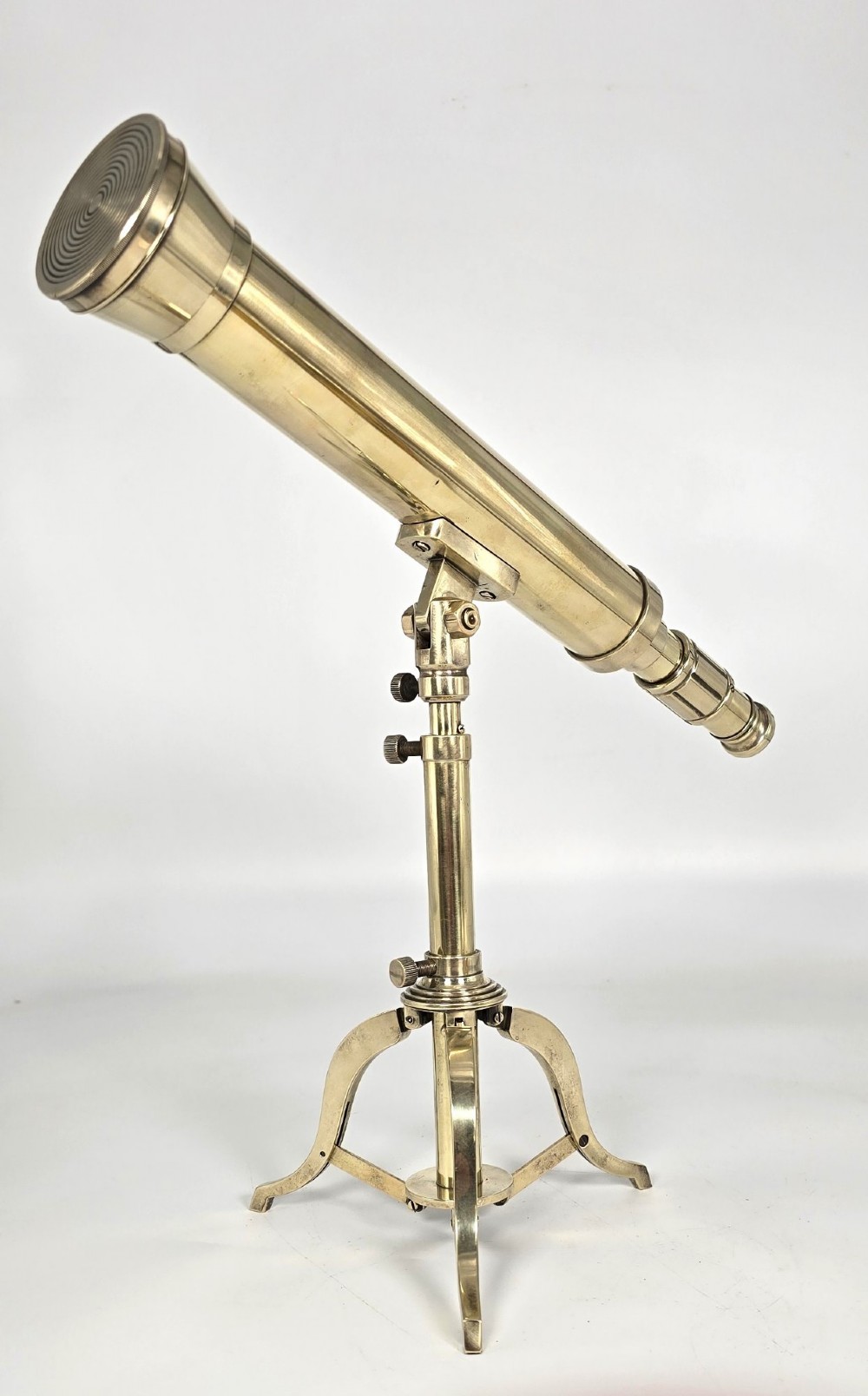 A Victorian brass table telescope mounted on a folding brass tripod stand. View V