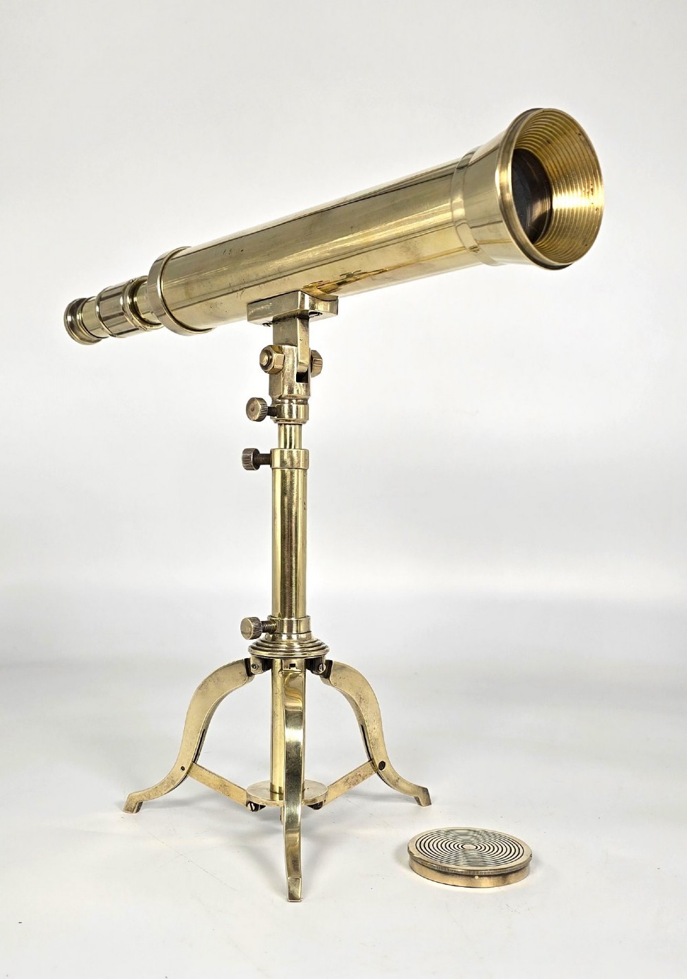 A Victorian brass table telescope mounted on a folding brass tripod stand. View VI