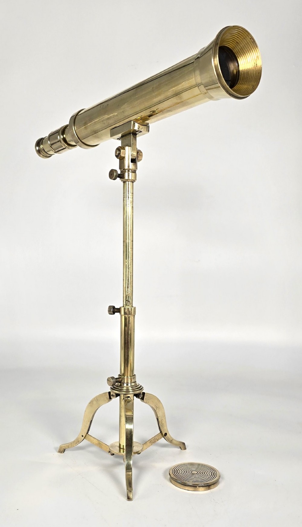 A Victorian brass table telescope mounted on a folding brass tripod stand. View VII