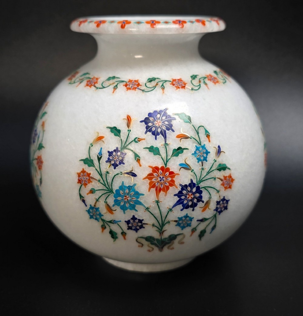 A globular white marble vase decorated with colourful floral inlays made from semi-precious stones. View VII