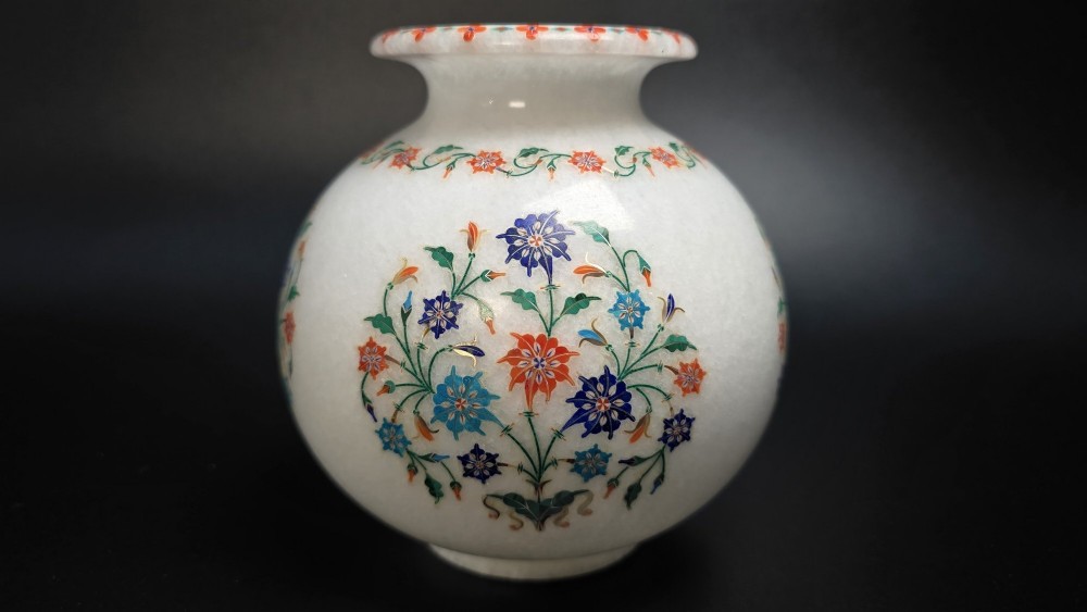 A globular white marble vase decorated with colourful floral inlays made from semi-precious stones. View IX
