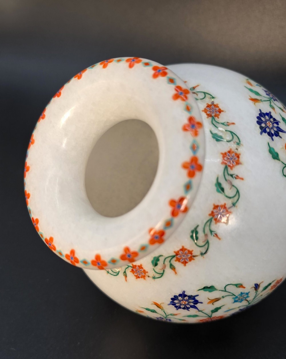 A globular white marble vase decorated with colourful floral inlays made from semi-precious stones. View XIV