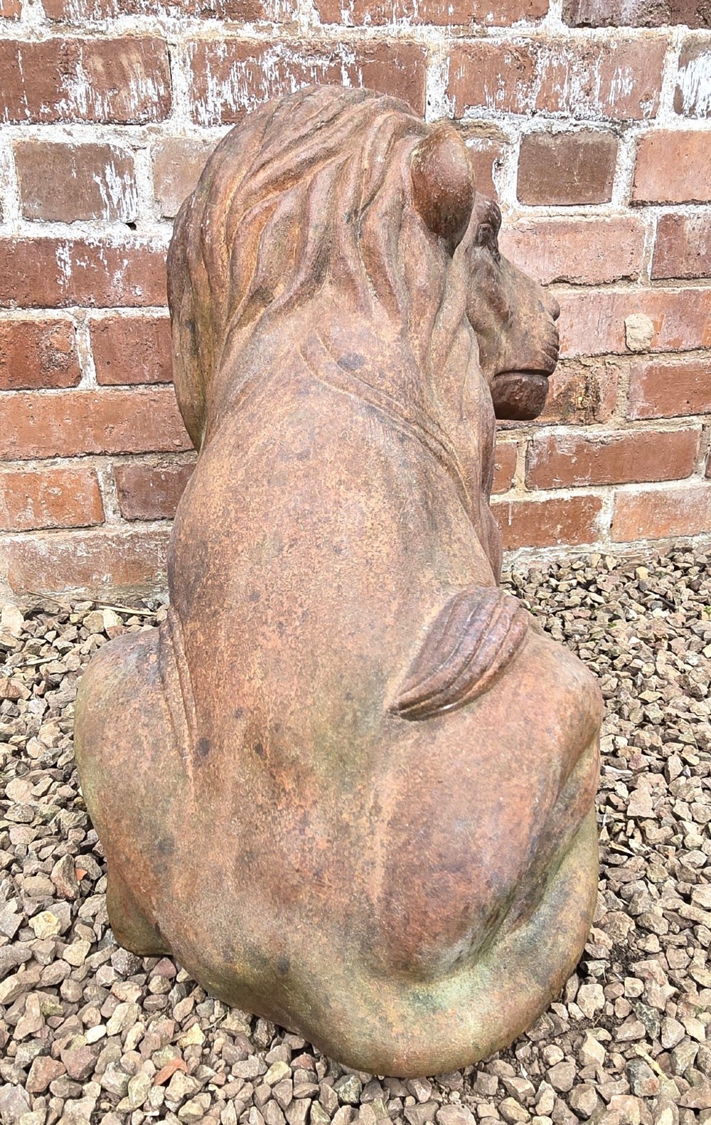A pair of hand-sculpted Italian terracotta seated lions with weathered patination. View VII