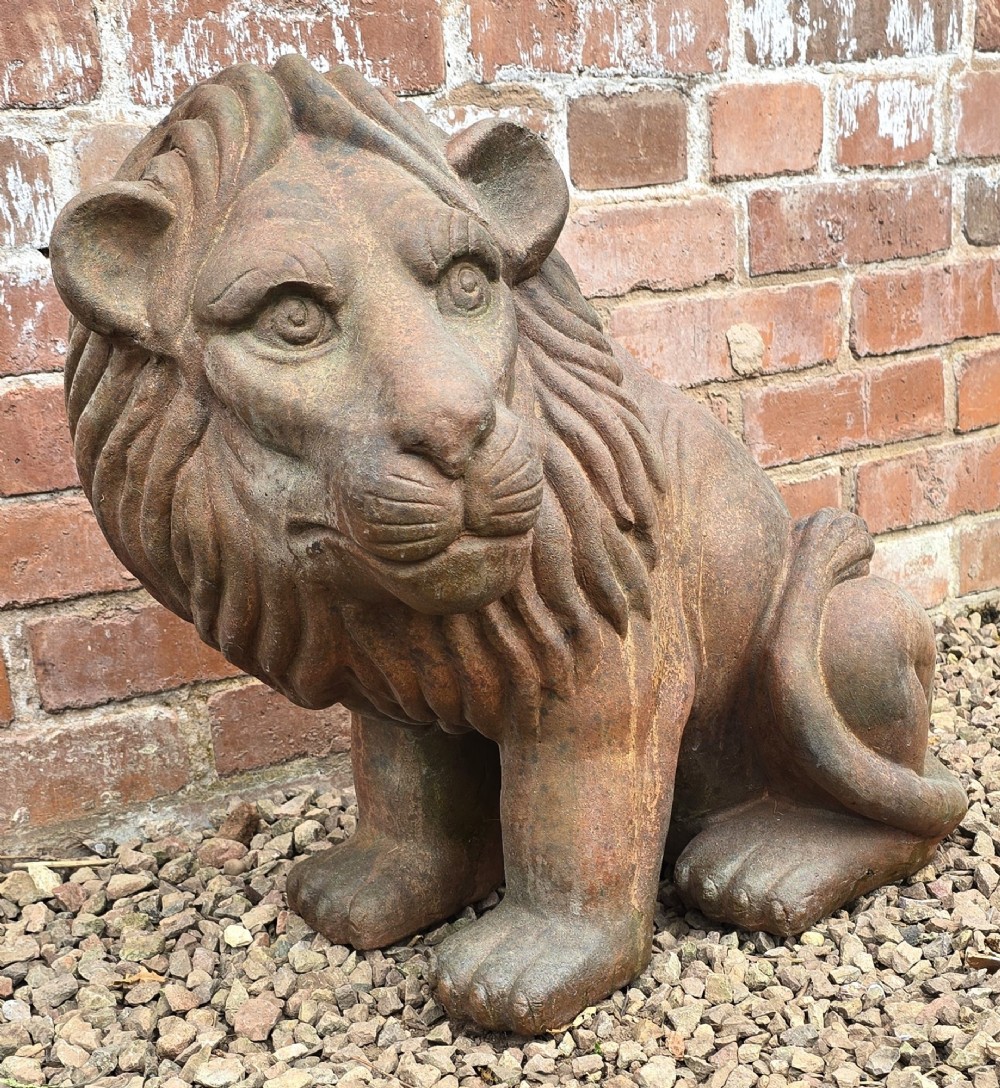 A pair of hand-sculpted Italian terracotta seated lions with weathered patination. View VIII