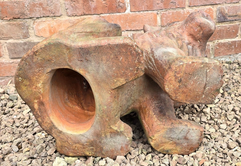 A pair of hand-sculpted Italian terracotta seated lions with weathered patination. View XIII
