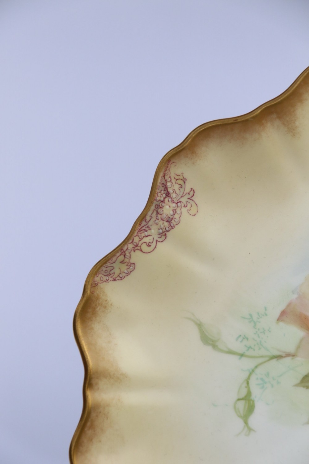 A silver-plated double frame holding two floral porcelain plates alongside a fitted cream jug and sugar bowl. View XII