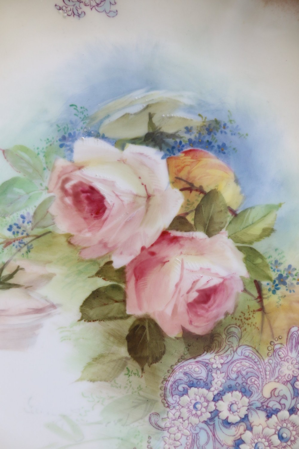 A silver-plated double frame holding two floral porcelain plates alongside a fitted cream jug and sugar bowl. View XIII