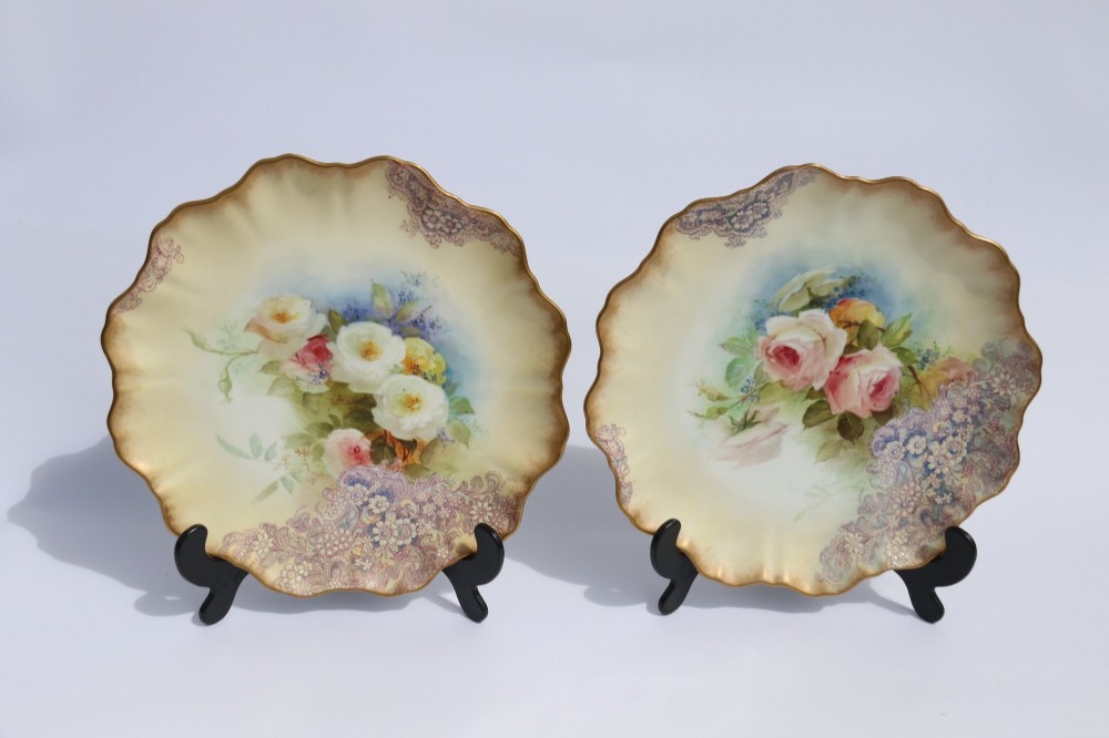 A silver-plated double frame holding two floral porcelain plates alongside a fitted cream jug and sugar bowl. View XV