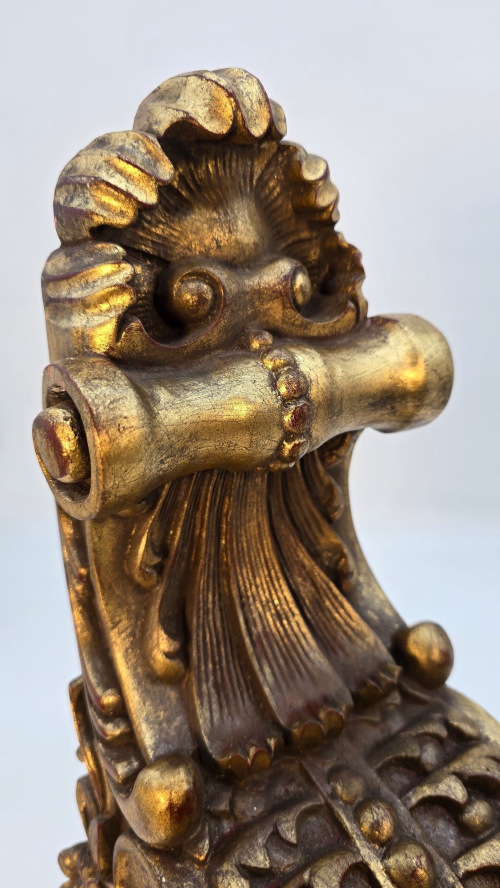 Pair of ornate Italian carved giltwood wall brackets featuring palmette leaf motifs and scrollwork finish. View IV
