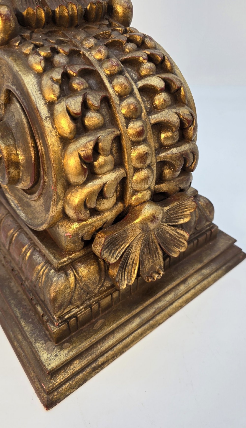 Pair of ornate Italian carved giltwood wall brackets featuring palmette leaf motifs and scrollwork finish. View V