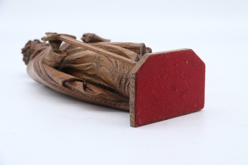 A carved oak wooden statue depicting Saint Paul holding a sword and scroll, standing on an octagonal wooden base. View XV