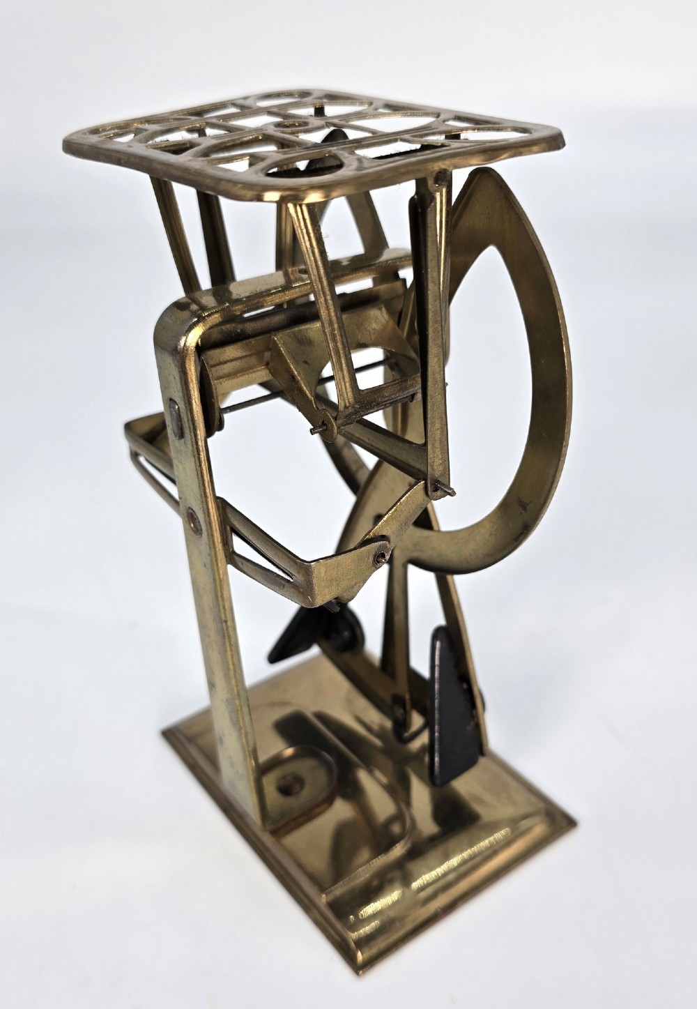 An Edwardian brass postal scale with an engraved curved measurement arc resting on a moulded rectangular base. View V