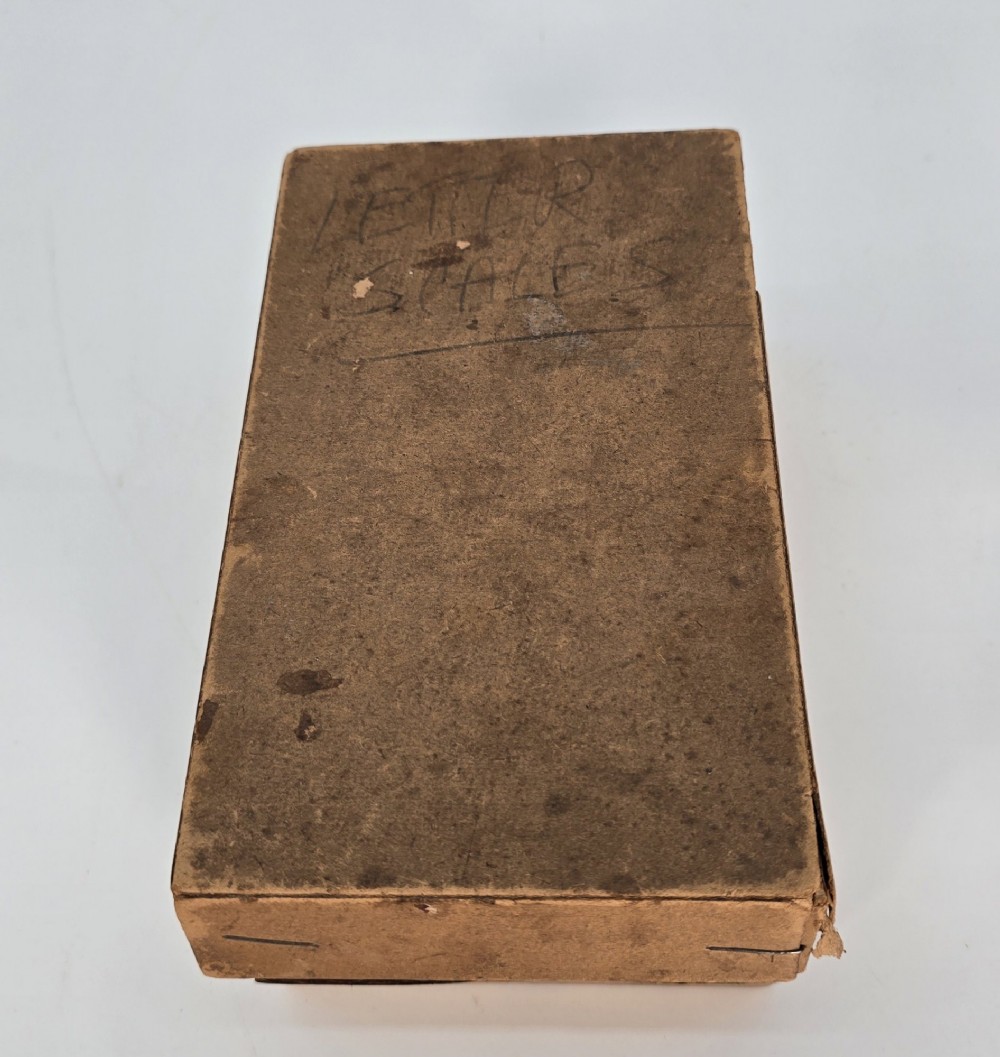 An Edwardian brass postal scale with an engraved curved measurement arc resting on a moulded rectangular base. View XIV