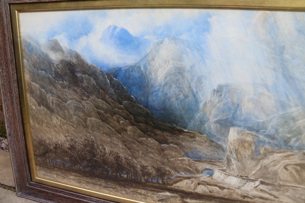 A framed 19th-century watercolour painting depicting the mountainous Pass of Llanberis in North Wales under a blue sky, set within a molded oak frame with a gilt slip. View III